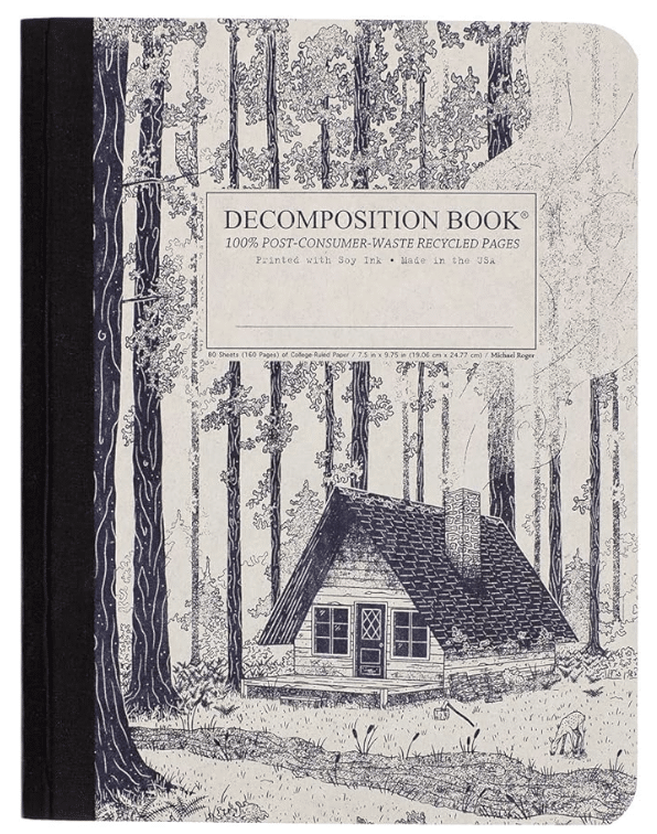 A Pop Culture Picks selection: This Decomposition Book notebook features a black spine and a black-and-white illustration of a cabin amid tall trees. Its cover label highlights that it’s made from 100% post-consumer-waste recycled paper.